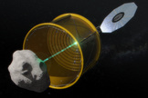 In this concept image, the robotic vehicle deploys an inflatable bag to envelop a free-flying small asteroid before redirecting it to a distant retrograde lunar orbit.