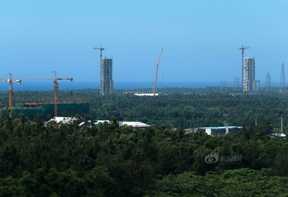 Work on China's newest spaceport on Hainan Island is in full swing with rocket assembly towers stretching into the sky.