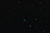 This wide-field view shows the sky around the planetary nebula Abell 33, which appears as the ghostly blue circle near the centre of the picture. Image released April 9, 2014.