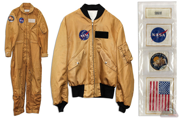 Among Jack Swigert's Apollo 13 flown mementos being auctioned in May 2014 are this command module heat shield plug, mechanical pencil and silver medallion.