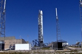A SpaceX Falcon 9 rocket and Dragon cargo ship stand atop its Florida launch pad ahead of a planned April 14, 2014 launch to the International Space Station. The mission for NASA will launch from Cape Canaveral Air Force Station.
