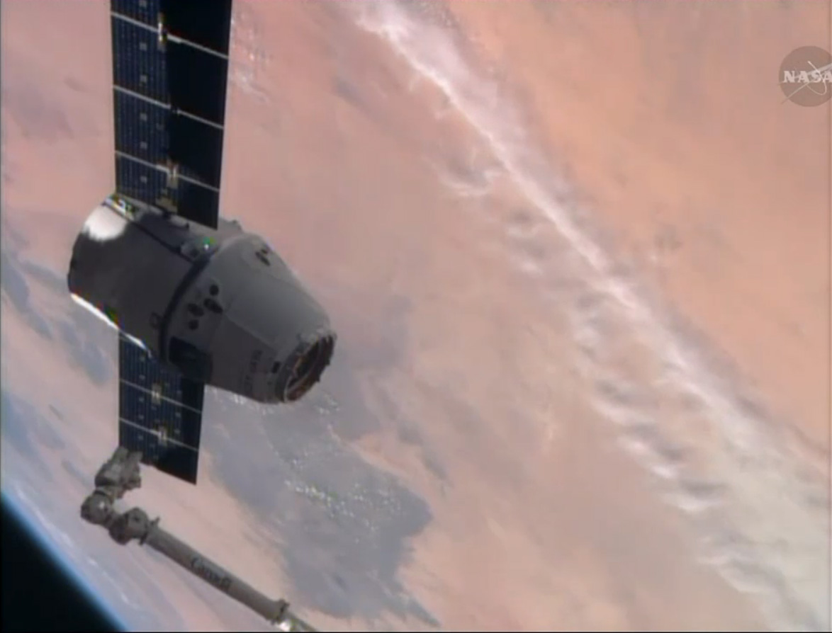 SpaceX Dragon Cargo Ship and Earth