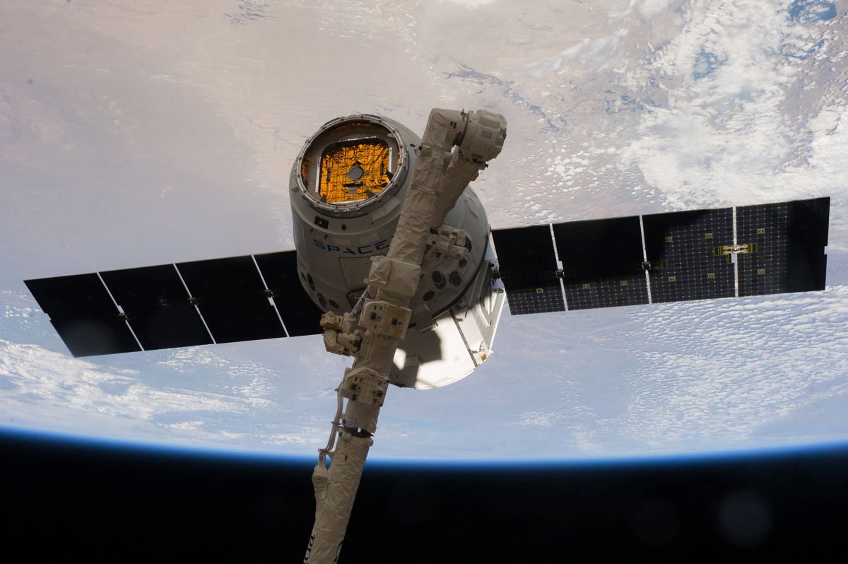 Dragon Capsule Grappled by International Space Station