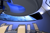 Boeing's new CST-100 commercial interior features the aerospace company's sky-blue interior lighting already featured in its modern airliners and uses a large digital display to substitute for passenger windows.