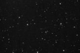 Comet 209P/LINEAR appears as a dim, dusty object at the center of this photo taken by NASA astronomers at the Marshall Space Flight Center in Huntsville, Ala. in May 2014. Dust from the comet is expected to create a meteor shower that will be first seen on Earth in May 2014.