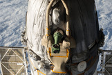 A Russian Soyuz spacecraft is seen docked to the International Space Station, as photographed by one of the Expedition 39 crew members aboard the orbital outpost.