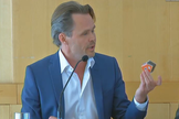 Moonhouse artist Mikael Genberg holds a scaled-down version of the Moonhouse up during a news conference in Sweden on May 28, 2014.