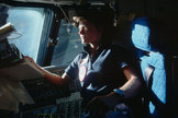 Sally Ride, America's first woman in space, looks out the forward windows of the space shuttle Challenger in June 1983.
