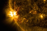 An X1 solar flare bursts off the left limb of the sun in this image captured by NASA's Solar Dynamics Observatory on June 11, 2014, at 9:05 a.m. EDT.