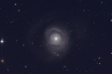 This image shows galaxy NGC 5548, where an odd stream of gas obscured the galaxy's center.