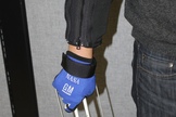 Demonstration of RoboGlove — spinoff technology from NASA's Robonaut program — providing assistance with a grasping task.