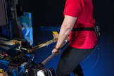 A person uses the ForceShoe on Earth before it launched to the International Space Station in late May 2014.