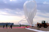 Workers fill a balloon on June 18, 2014, during the lead-up to the first test flight by Arizona-based company World View, which aims to start carrying passengers on near-space cruises by 2016.