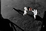 NASA astronauts Buzz Aldrin and Neil Armstrong raise the American flag on the moon during their July 20-21, 1969 moonwalk during the historic Apollo 11 lunar landing mission.