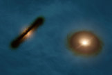 The artist's impression shows what the two stars of the HK Tauri system might look like with their skewed planetary disks.