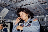Astronaut Sally K. Ride, STS-7 mission specialist and first American woman in space, is seen here on the flight deck of the space shuttle Challenger, June 18, 1983.