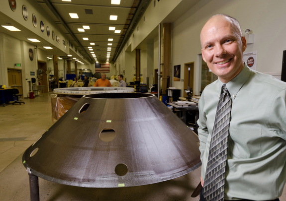 Stu Spath, InSight program manager at Lockheed Martin Space Systems Company, near the back shell for the Mars-bound Interior exploration using Seismic Investigations, Geodesy and Heat Transport (InSight) spacecraft.