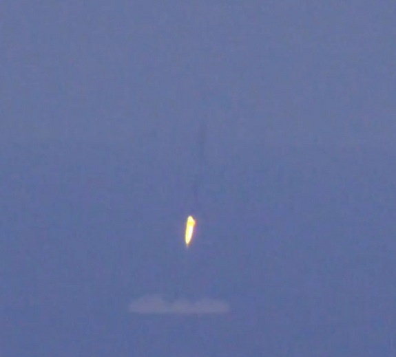 SpaceX's Falcon 9 rocket's boost stage made a landing in the Atlantic Ocean after delivering six satellites to orbit on July 14, 2014.
