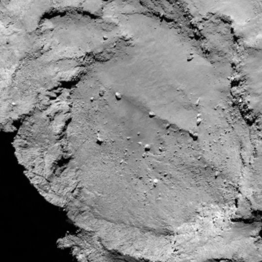 Candidate site B is located within the crater-like structure on the smaller lobe. This site seems relatively safe for landing as it has flat terrain, but illumination conditions may not be optimal. Image released Aug. 25, 2014.