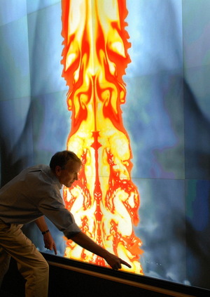 Data gleaned from hush-hush satellite sensors can be folded into other data sets to better model just how much the Earth is on the receiving end of incoming natural objects. Picture shows Sandia National Laboratories researcher Mark Boslough reviewing a supercomputer simulation of an asteroid fireball exploding in Earth's atmosphere.