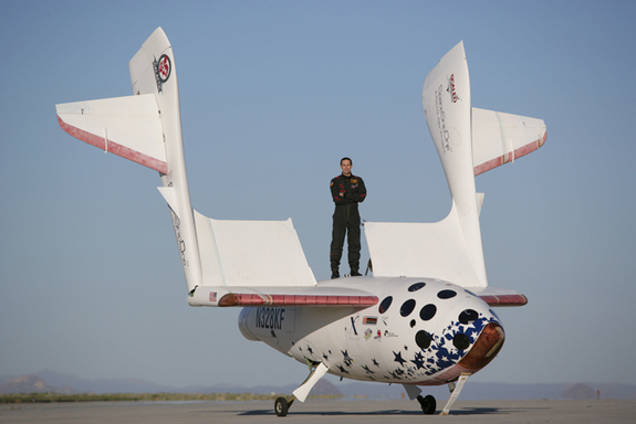 Pilot Brian Binnie stands atop SpaceShipOne, which won the $10 million Ansari X Prize by reaching space twice within the span of two weeks in 2004.