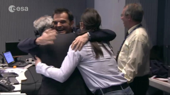 ESA staff members at ESA's European Space Operations Center in Darmstadt, Germany, celebrate the landing of Philae probe on Comet 67P/Churyumov-Gerasimenko, Nov. 12, 2014.