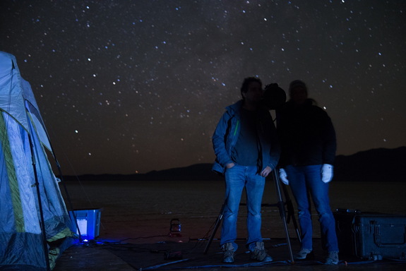 Steve Warwick, Northrop Grumman program manager for Starshade field testing, and Tiffany Glassman, astronomer and principal investigator for Starshade field testing, stand in the Starshade's shadow at the telescope station, demonstrating the technology's desired effect.