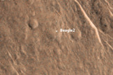 Officials think that the Beagle 2 lander (seen as a bright spot here) partially deployed its solar panels when it reached the surface of Mars in 2003. European Space Agency officials lost contact with the lander after it was released down to the surface of the Red Planet. Image uploaded Jan. 16, 2015.
