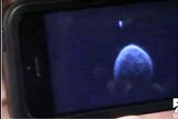 An image of asteroid 2004 BL86 taken the morning of Jan. 26, the day of its closest approach to Earth, shows a moon orbiting just above the asteroid, and indications of surface features like boulders. This photo was shown by NASA's Lance Benner during a webcast aired by the Slooh Community Observatory.