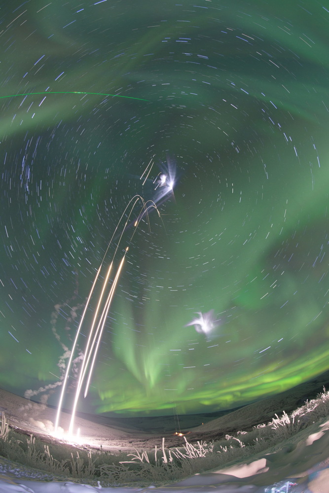 Four Rockets Launch with Aurora
