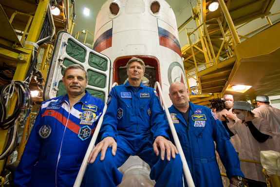 NASA's Scott Kelly (right) and cosmonaut Mikhail Kornienko (left) will fly to the International Space Station for a yearlong stay in space on March 27, 2015. Cosmonaut Gennady Padalka (center) will join them on the station for about six months.