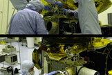 Technicians install and work on two instruments aboard NASA's Pluto-bound New Horizons spacecraft that are making measurements of space weather today.