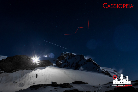 The big W of Cassiopeia, marked in red, shines bright over an alpine hut, high in the Italian mountains, with the International Space Station (seen as a light streak) making a flyby.