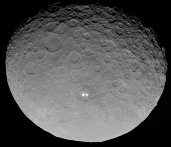 NASA's Dawn spacecraft captured this image of the dwarf planet Ceres and its mysterious bright spots on May 4, 2015, from a distance of 8,400 miles (13,500 kilometers).