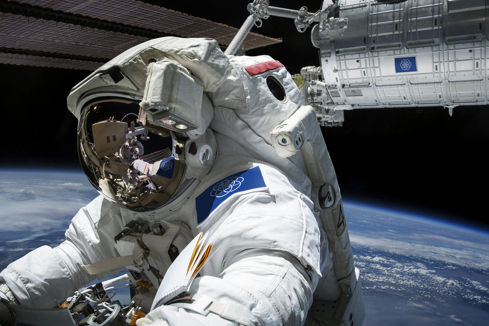 Astronaut Wearing the Proposed International Flag of Planet Earth