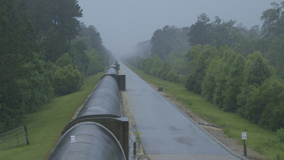 The x-arm of the LIGO Observatory in Livingston, Louisiana in an afternoon thunderstorm.