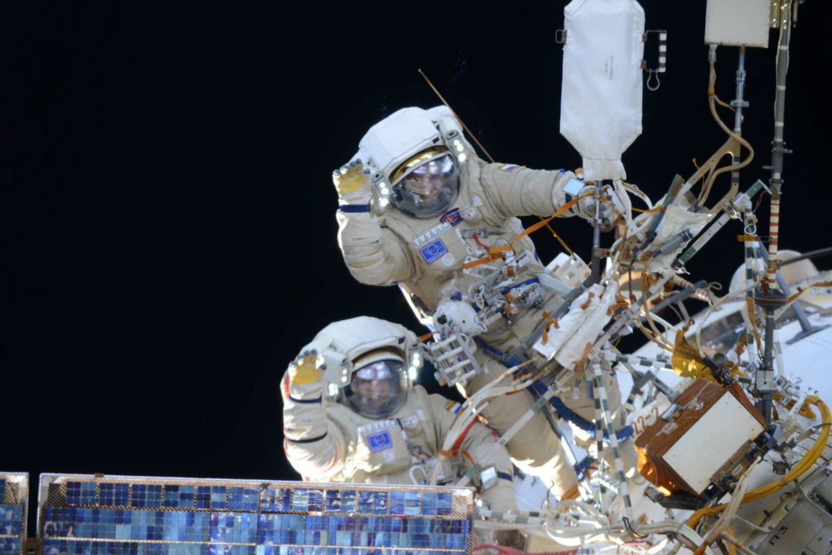 Cosmonauts Wave During EVA