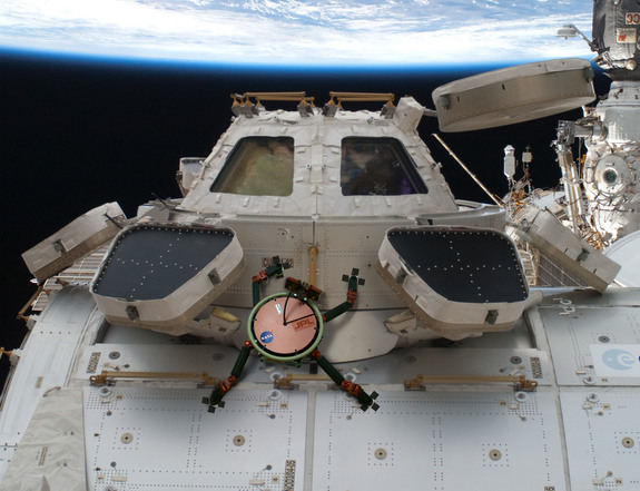This artist's concept shows how a future robot called LEMUR (Limbed Excursion Mechanical Utility Robot) could inspect and maintain installations on the International Space Station. The robot would stick to the outside using a gecko-inspired gripping system.