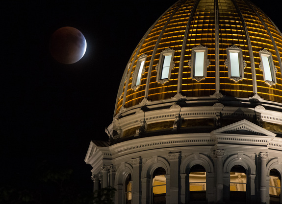 Bill Ingalls prisoner this shot of a 'supermoon' lunar obscure Sept. 27 over a Colorado State Capitol Building in Denver.