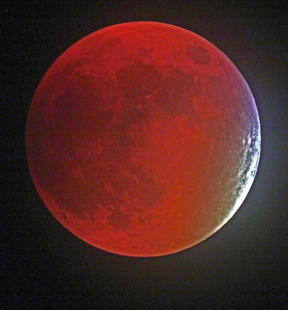 Despite lots of clouds and sleet on a way, Victor Rogus grabbed this design of a Sept. 27 'supermoon' lunar obscure in Manatee County, Florida. -- Before clouds cursed my efforts, he told Space.com.