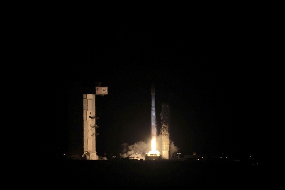 A United Launch Alliance Atlas V rocket lifts off from California's Vandenberg Air Force Base carrying the classified NROL-55 satellite for the U.S. National Reconnaissance Office, as well as 13 tiny cubesats for the NRO and NASA, during a pre-dawn launch on Oct. 8, 2015.