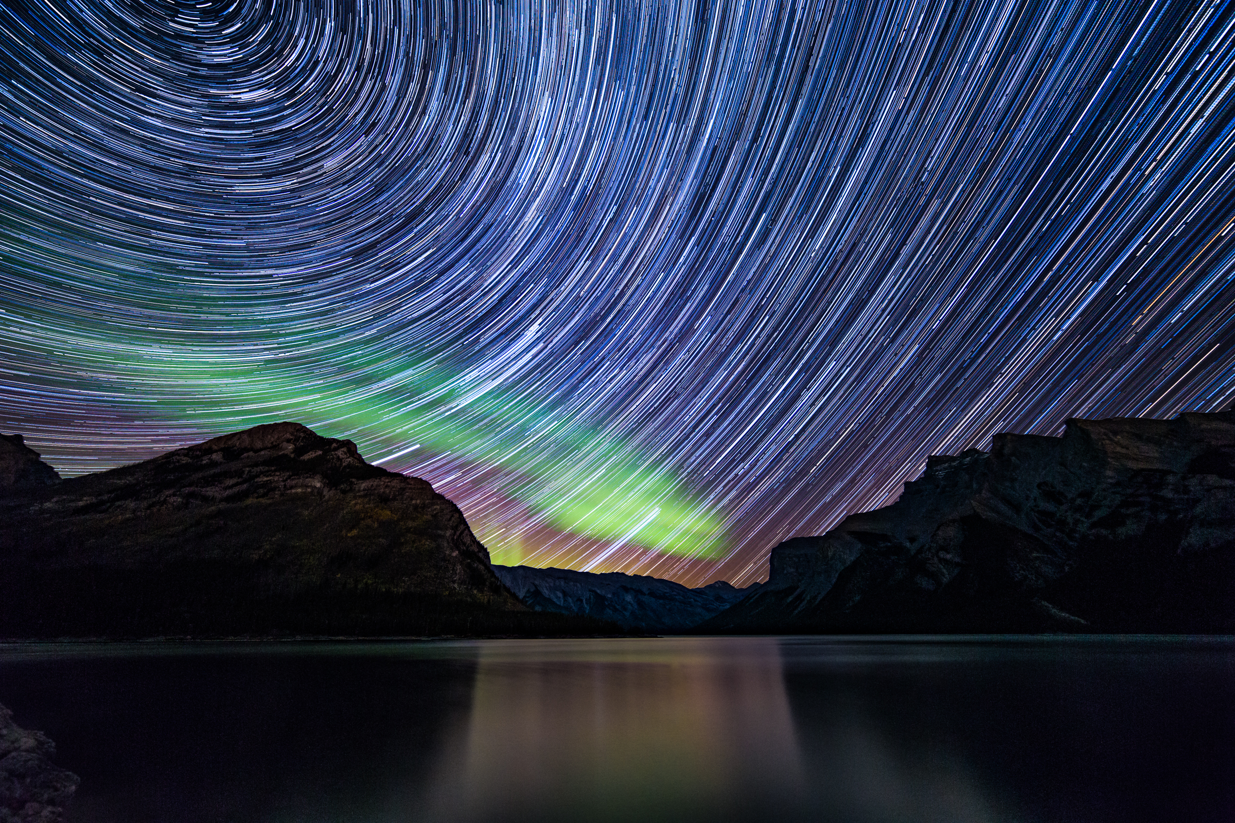 Star Trails and a Green Auroras Shine in Astrophotographer Photo
