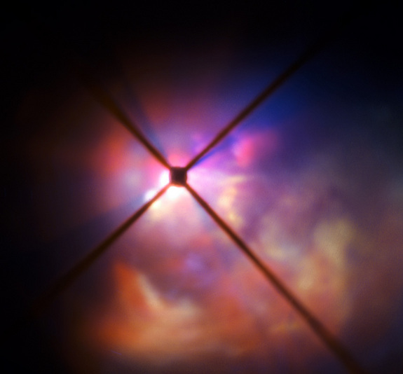 Images from the Very Large Telescope in Chile let researchers examine the large dust grains surrounding the red hypergiant star VY Canis Majoris to see how it sheds mass so quickly. Here, the SPHERE instrument blocks out the star (center) to get a better look at the clouds of material surrounding the star.