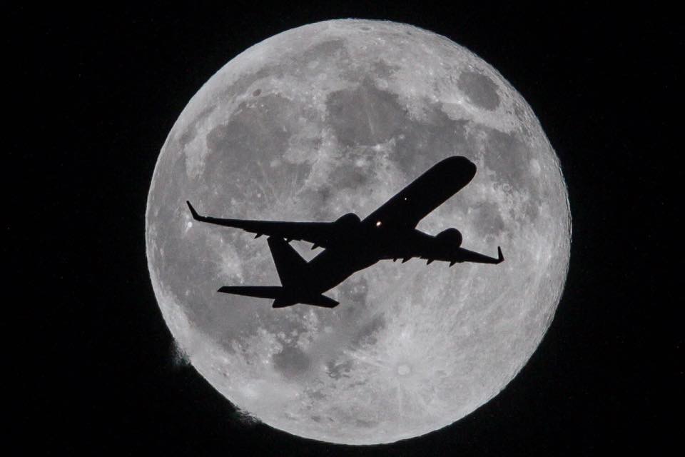 Plane Crossing the Moon by Raul Roa