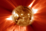 A snapshot of a coronal mass ejection firing off the surface of the sun, captured by NASA's SOHO spacecraft. This image shows the sun in ultraviolet light, while the field of view extends over 2 million kilometers, or 1.243 million miles, from the solar surface. 