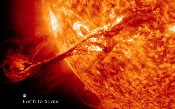 Image of the Earth to scale with the filament eruption. Note: the Earth is not this close to the sun, this image is for scale purposes only. 