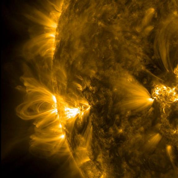 An image of coronal loops on the sun that are linked to magnetic fields. 