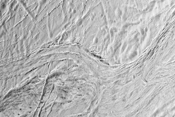 On Saturn's ice-covered moon Enceladus, nearly parallel ridges and furrows mark a region known as Samarkand Sulci in this image as seen by NASA's Cassini spacecraft during its final close flyby of the moon on Dec. 19, 2015.