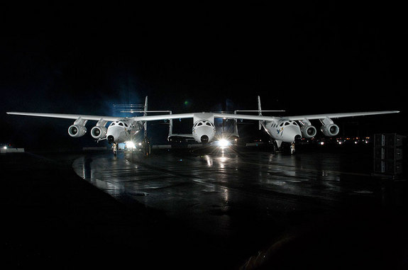 Virgin Galactic's first SpaceShipTwo, the VSS Enterprise, mounted under the WhiteKnightTwo carrier aircraft, was revealed in 2009.