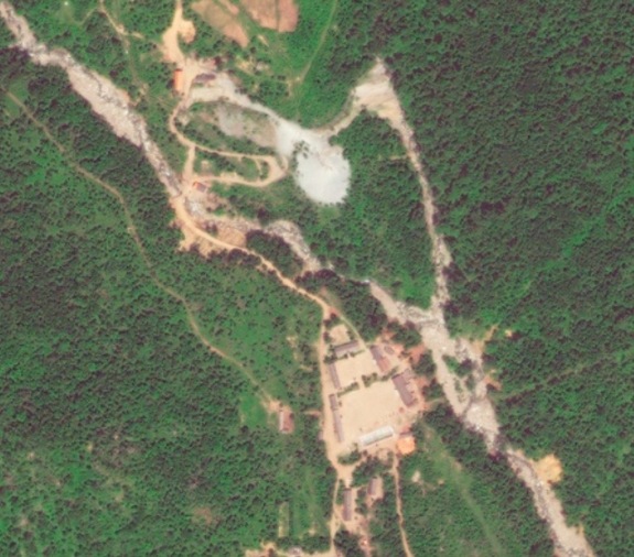 This later DigitalGlobe image shows modifications to the Punggye-ri site in North Korea. In January 2016, significant seismic activity was recorded in North Korea. Some experts, but not all, say that it could have been a result of nuclear testing at this site. This photo is one of a series of Punggye-ri images that have been analyzed by the company Spaceknow.